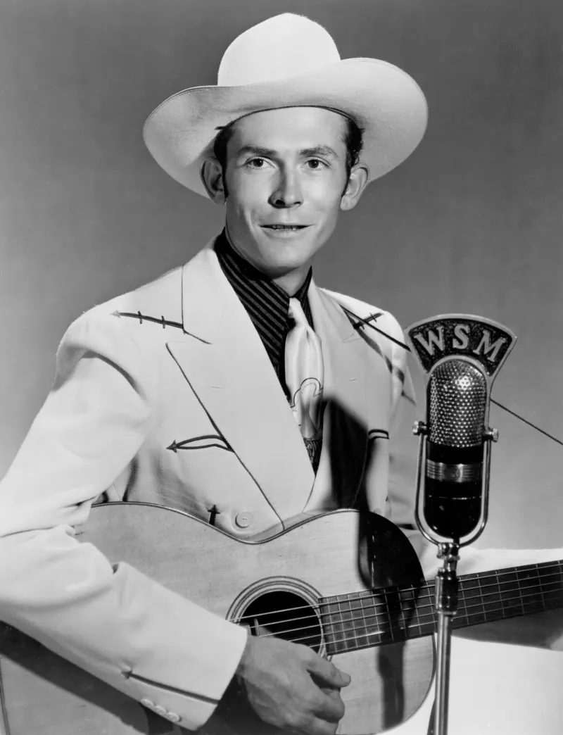 Hank Williams at a WSM microphone in a promotional photograph