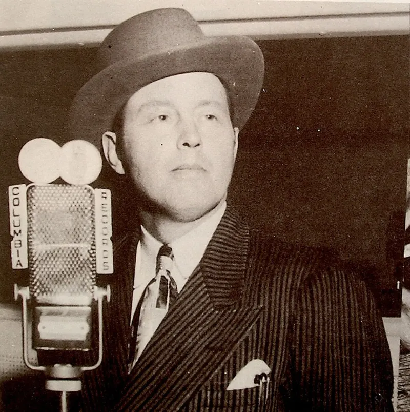 Bill Monroe at a radio microphone in 1952