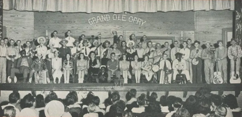 A vintage photograph of the Grand Ole Opry cast on stage