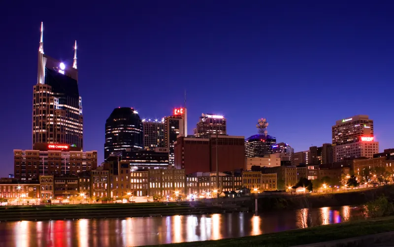 The Nashville skyline at night, reflected in the Cumberland River