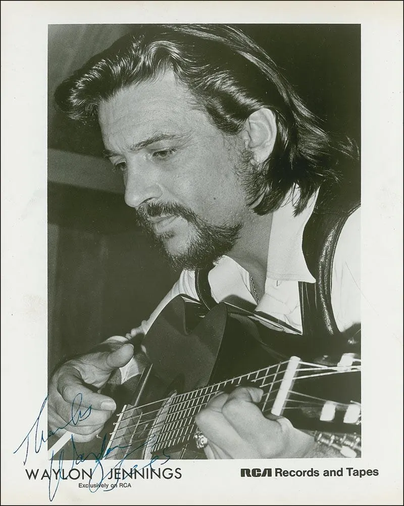 Waylon Jennings with his guitar in an RCA promotional photograph